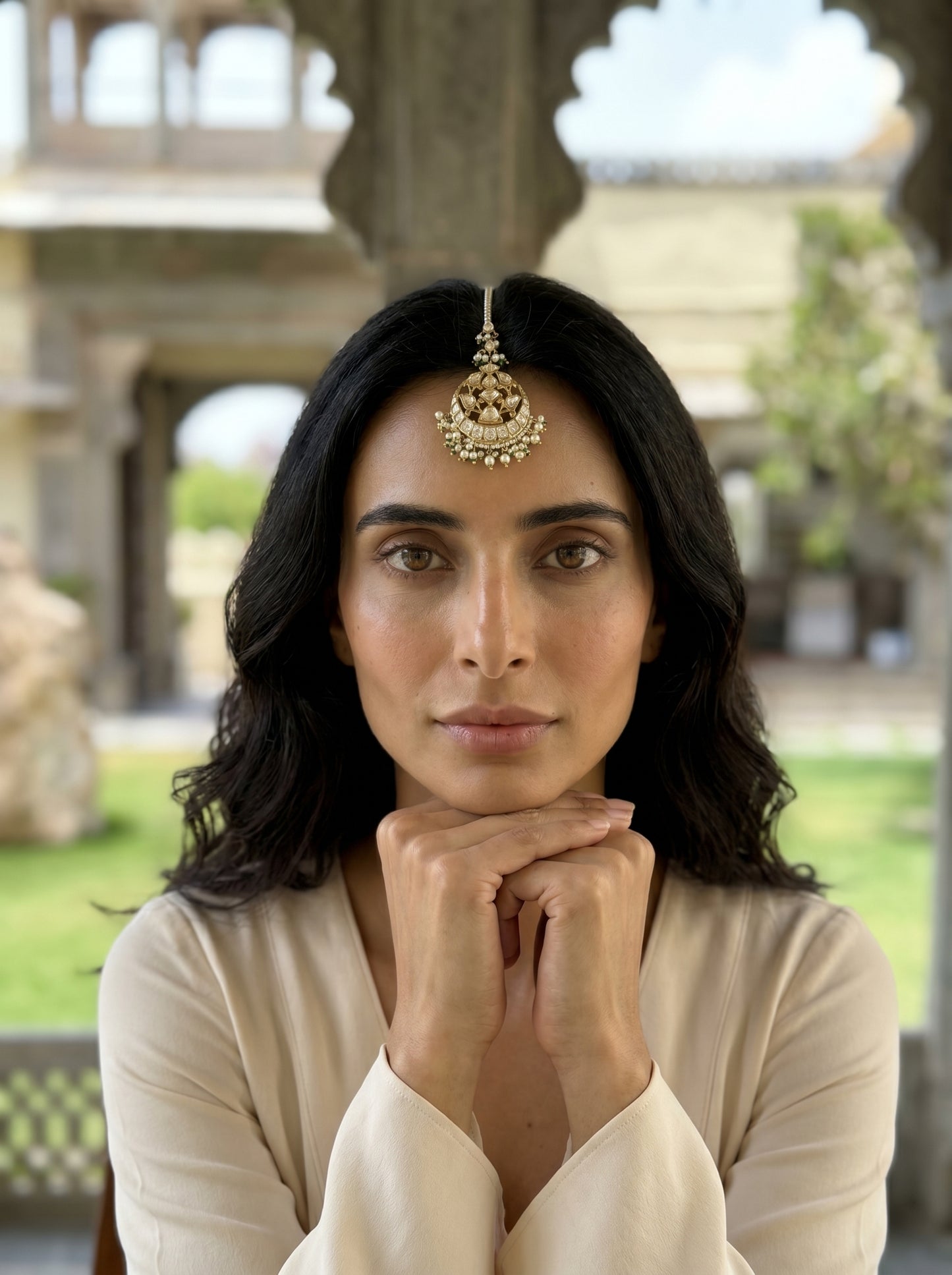 Woman with traditional jewelry in an outdoor setting
