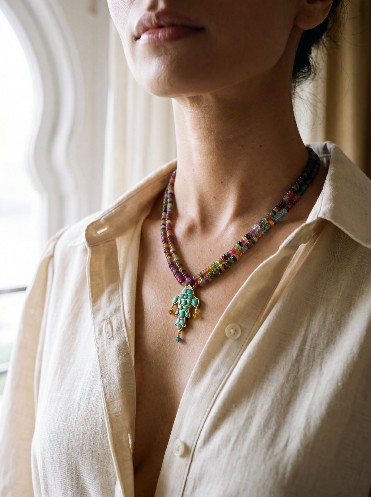 Turquoise fish pendant on a multicolour semi-precious bead strand