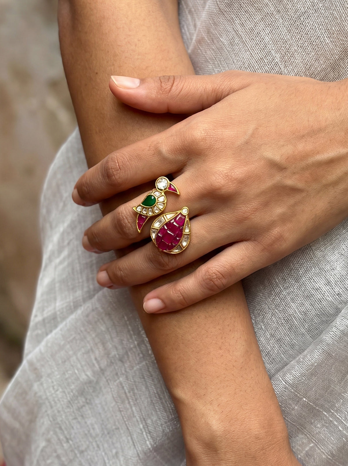 Kundan ring with a ruby pomegranate and emerald parrot motif