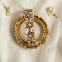 Jadau Kundan pearl bangle encrusted in seed pearls with kundan star motifs