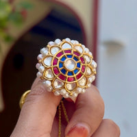 925 silver rakhdi with polki kundan and ruby-sapphire meenakari, gold plated