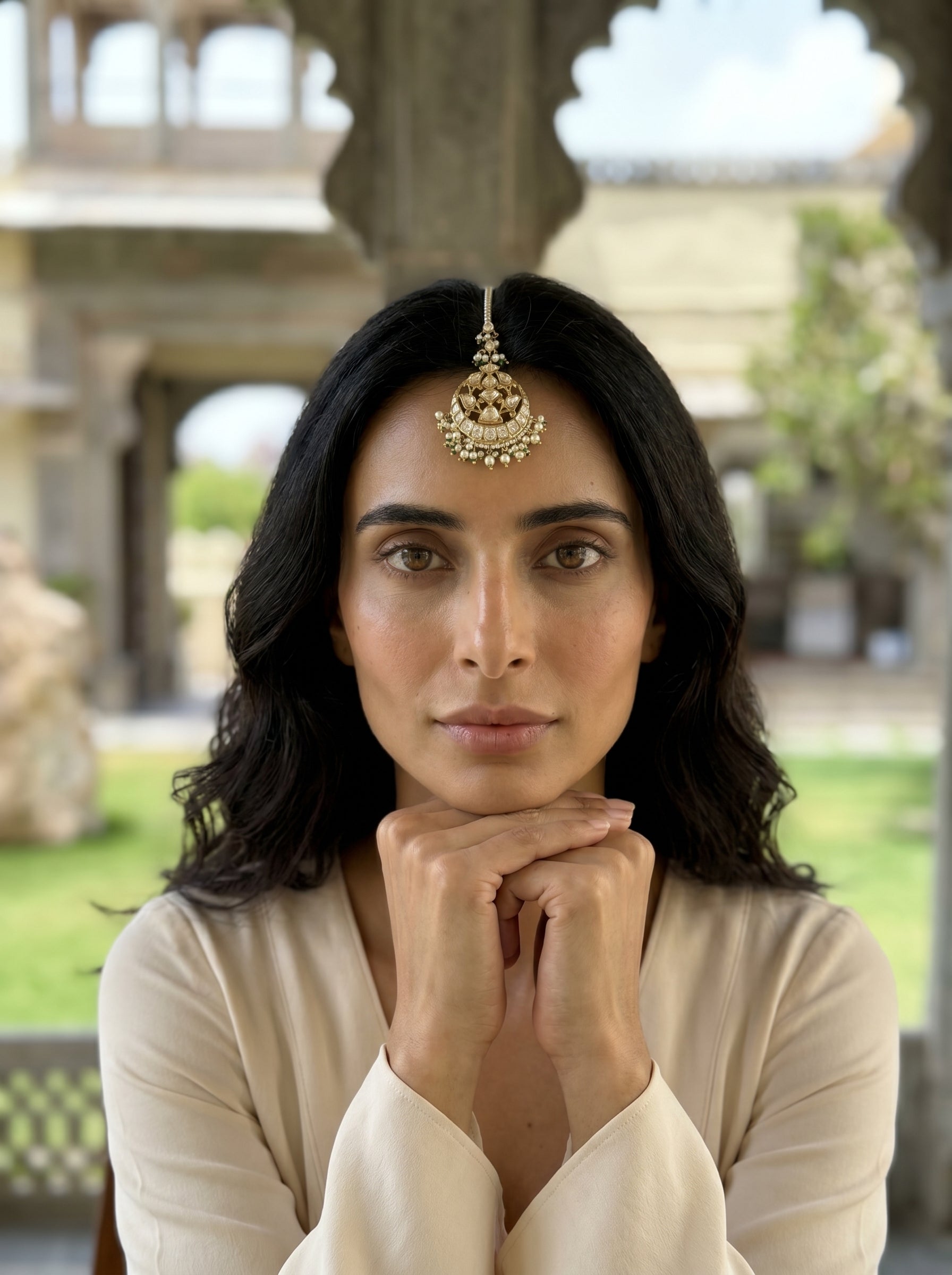 Woman with traditional jewelry in an outdoor setting