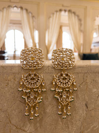 Kundan three-tier chandelier earrings with a mandala disc and pearl-emerald drops