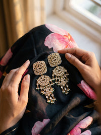 Kundan three-tier chandelier earrings with a mandala disc and pearl-emerald drops