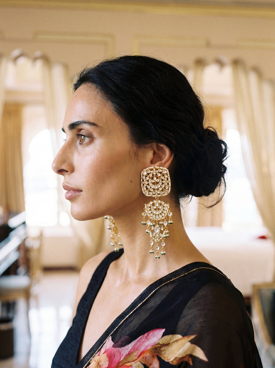 Kundan three-tier chandelier earrings with a mandala disc and pearl-emerald drops