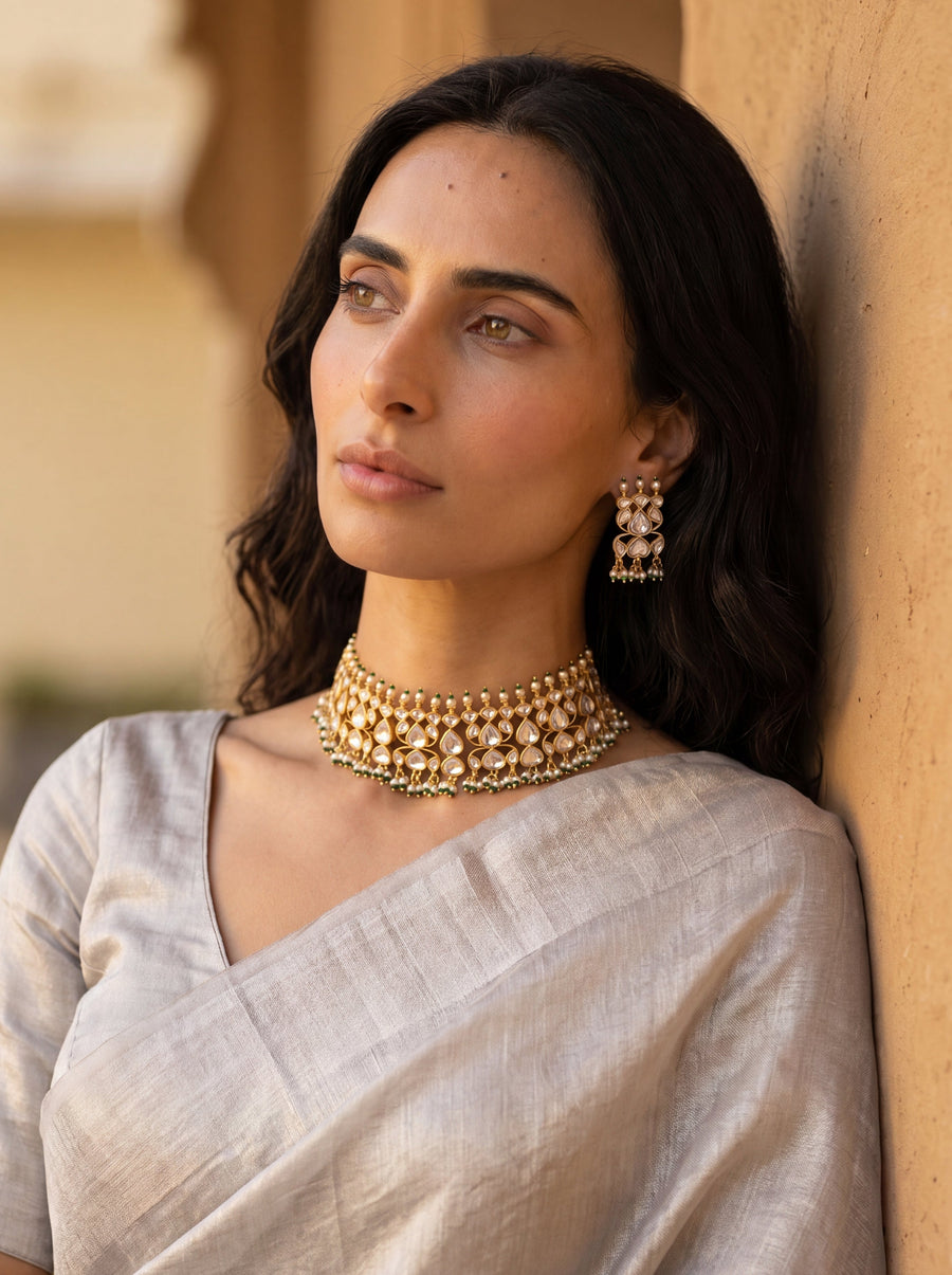 Jadau Kundan choker set with dense teardrop stones and matching earrings