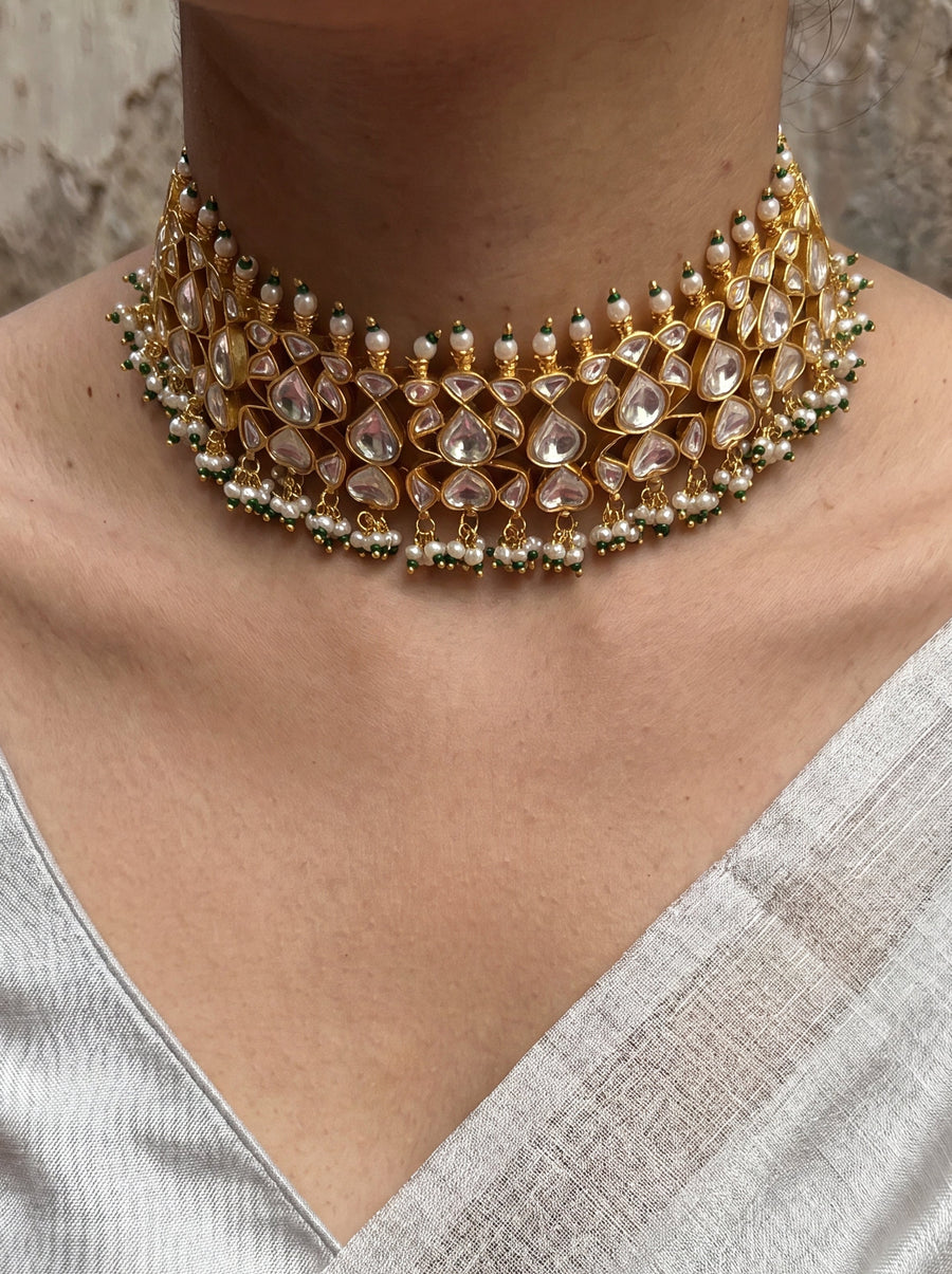 Jadau Kundan choker set with dense teardrop stones and matching earrings