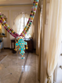 Turquoise fish pendant on a multicolour semi-precious bead strand