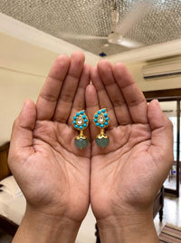 Jadau Kundan stud earrings with a carved gemstone drop, in turquoise or white