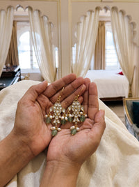 Kundan Polki fish-motif drop earrings with carved jade and pearl drops