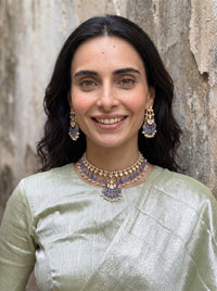 Jadau Kundan necklace set with a blue meenakari pendant and lavender beads