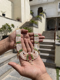 Jadau Kundan haar with six pearl strands and a ruby-emerald pendant
