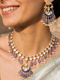 Jadau Kundan necklace set with a blue meenakari pendant and lavender beads