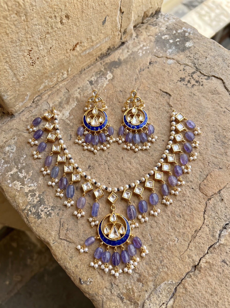 Jadau Kundan necklace set with a blue meenakari pendant and lavender beads