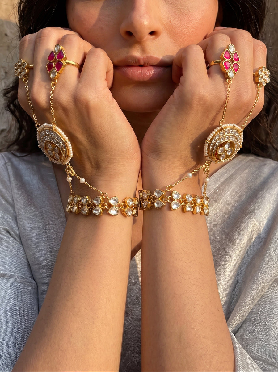 Jadau Kundan hathphool with a mandala centrepiece and pearl drops, sold as a pair