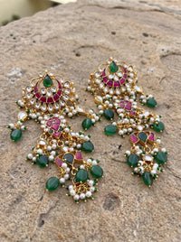Jadau Kundan chandelier earrings with tiered polki drops and pearl or ruby gemstone clusters
