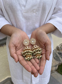 Jadau Kundan jhumka earrings with a dome body and triple-tier pearl fringe