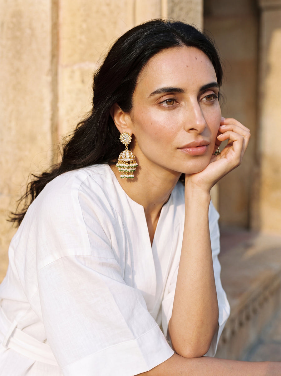 Jadau Kundan jhumka earrings with a dome body and triple-tier pearl fringe