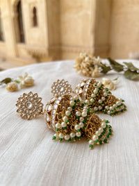 Jadau Kundan jhumka earrings with a dome body and triple-tier pearl fringe