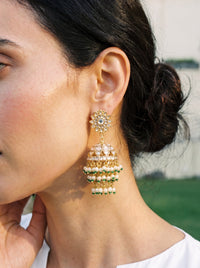 Jadau Kundan jhumka earrings with a dome body and triple-tier pearl fringe