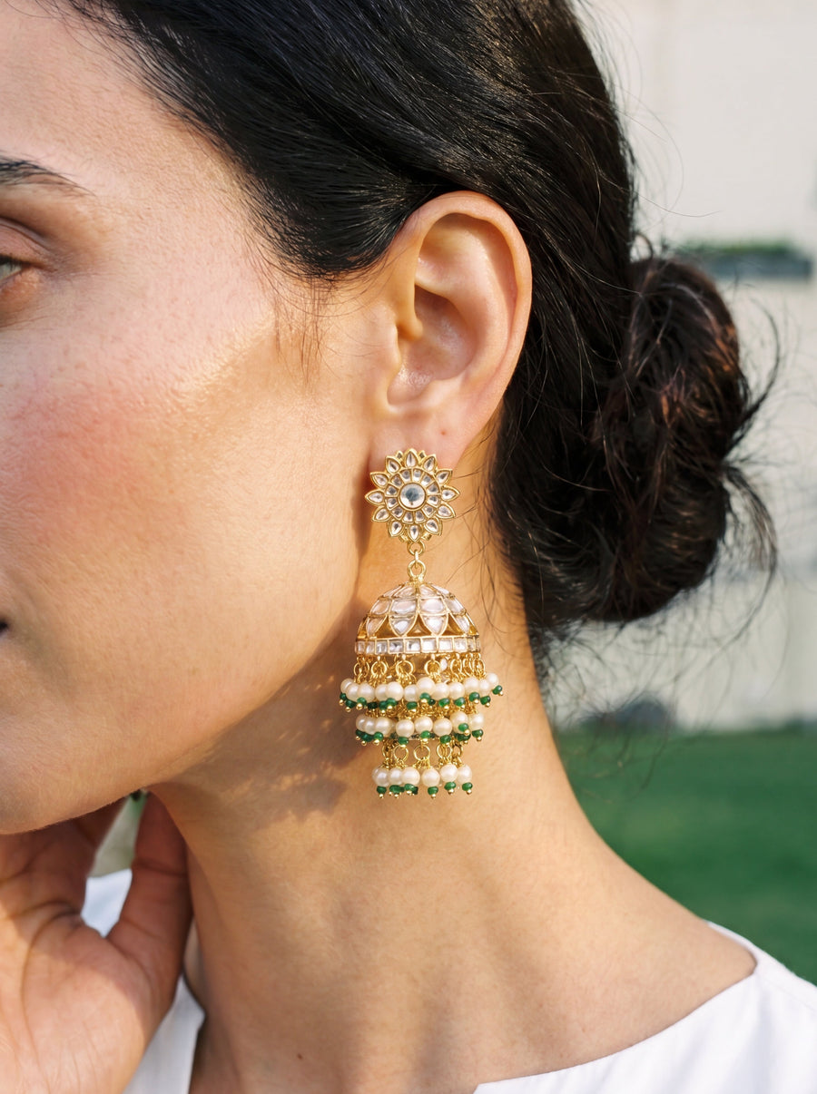 Jadau Kundan jhumka earrings with a dome body and triple-tier pearl fringe