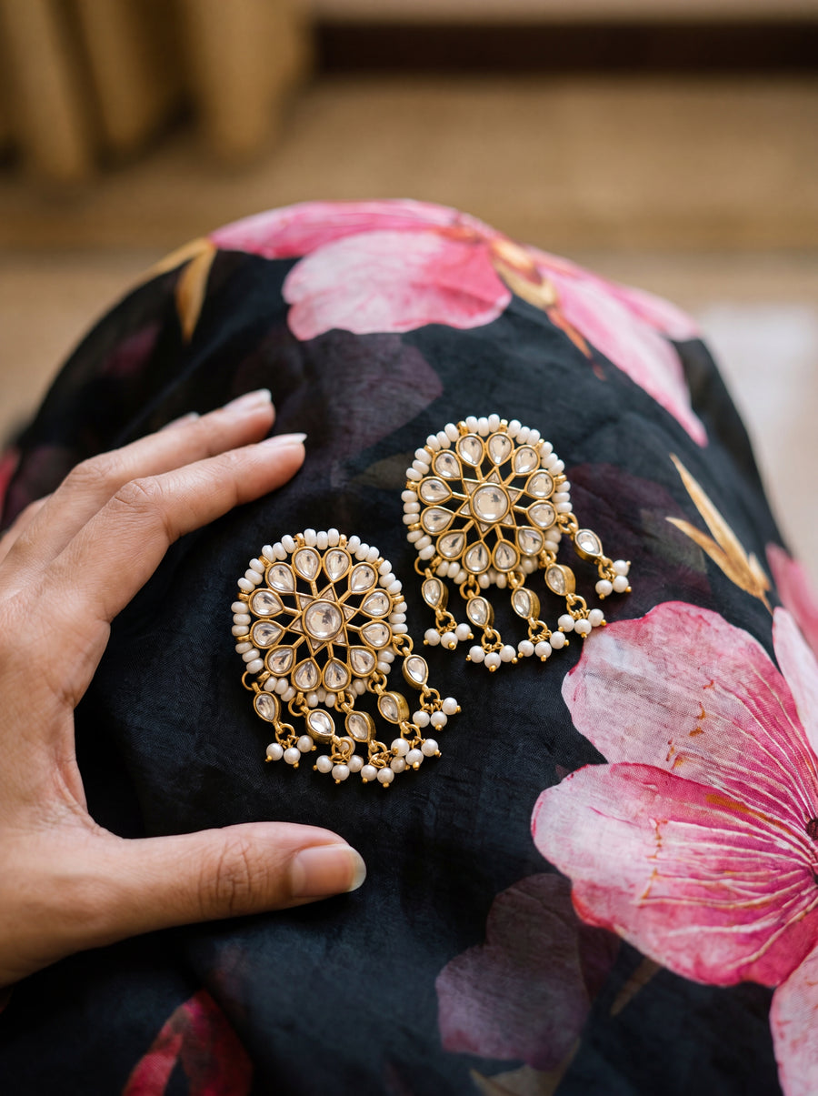 Gold-plated statement earrings with a turquoise floral cluster and pearl fringe