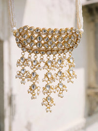 Kundan Polki timaniya choker with a teardrop fringe and pearl-strand ties