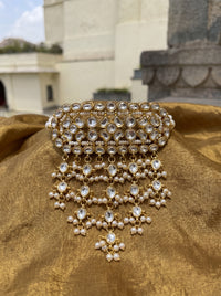 Kundan Polki timaniya choker with a teardrop fringe and pearl-strand ties