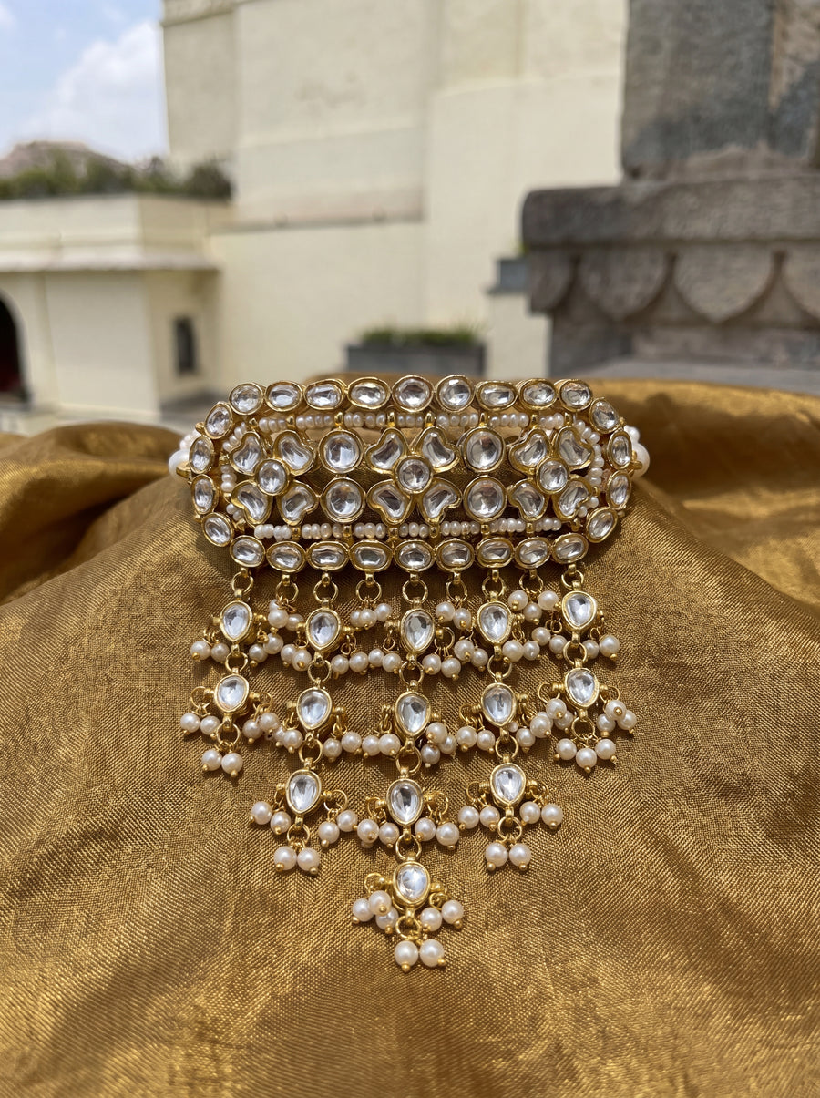 Kundan Polki timaniya choker with a teardrop fringe and pearl-strand ties