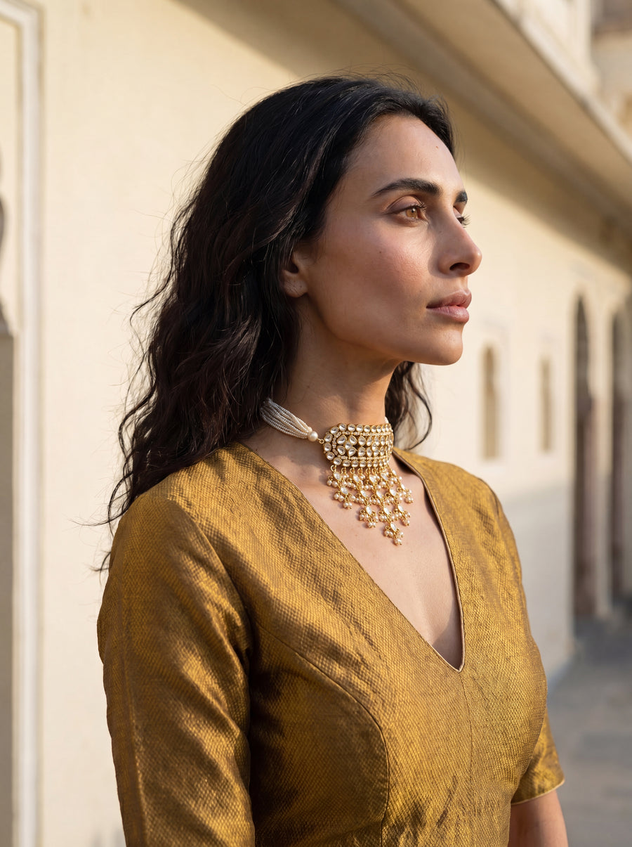 Kundan Polki timaniya choker with a teardrop fringe and pearl-strand ties