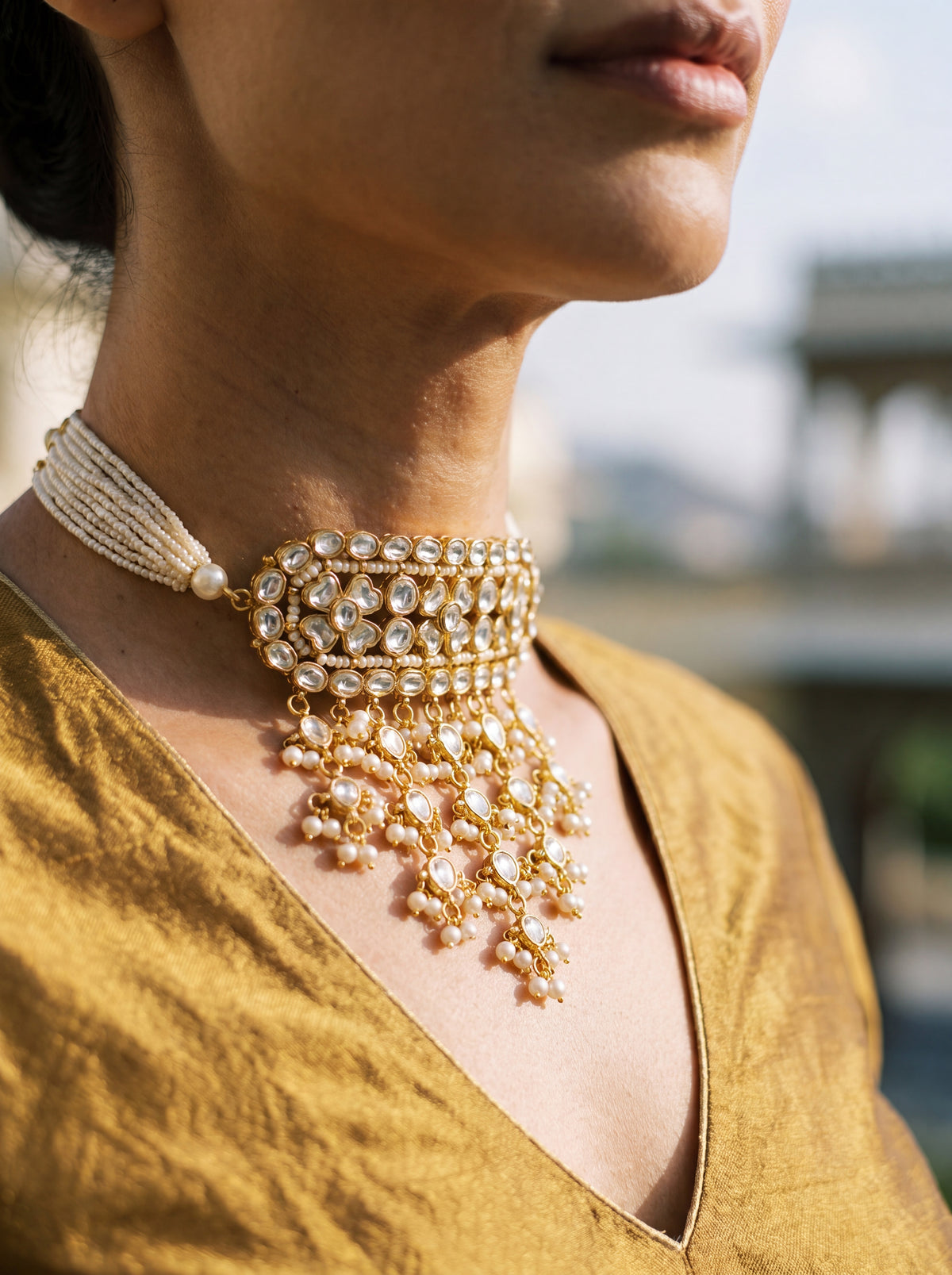 Kundan Polki timaniya choker with a teardrop fringe and pearl-strand ties
