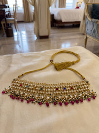 Kundan Polki choker set with all nine Navratna gemstones and a silk-tassel dori