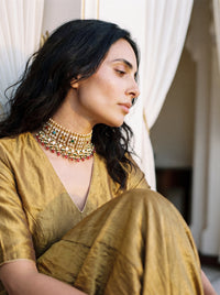 Kundan Polki choker set with all nine Navratna gemstones and a silk-tassel dori