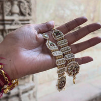 Jadau Kundan traditional ear-to-ear chain with a ruby-centred pearl disc