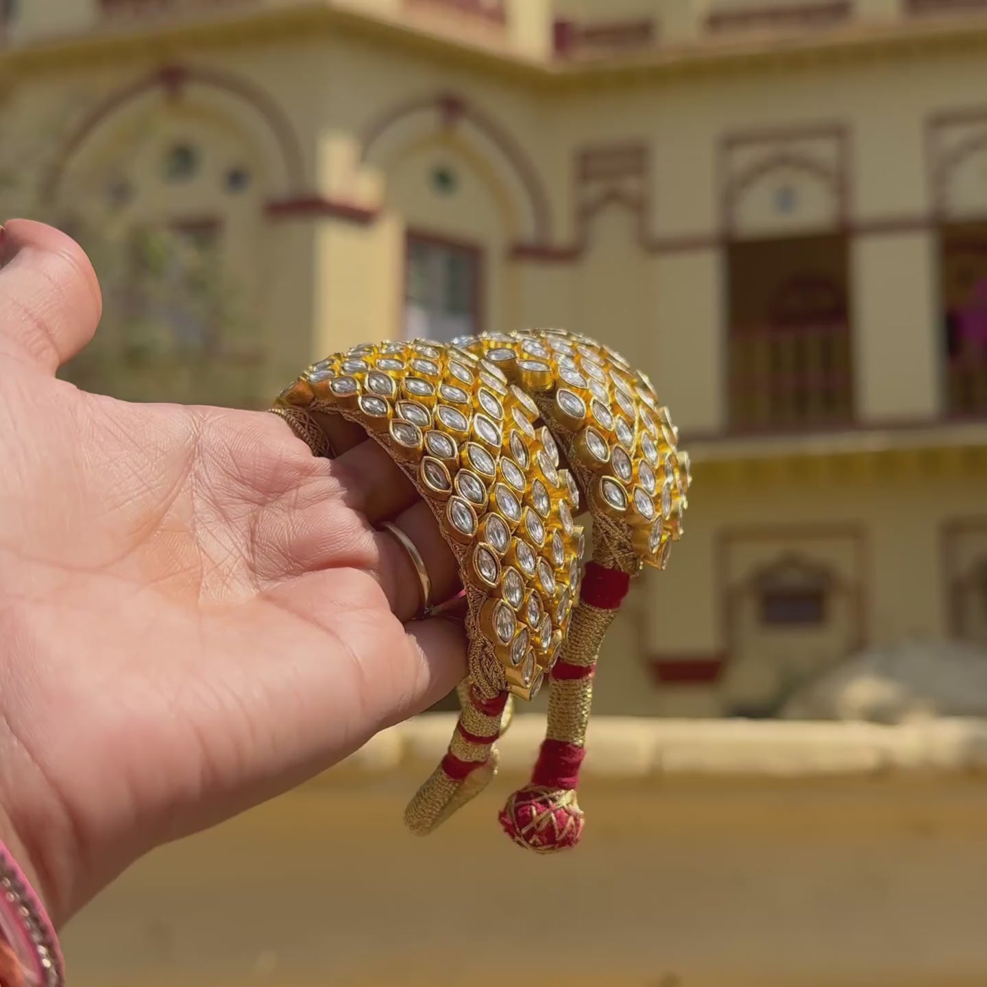 Jadau Kundan bridal cuff bracelet with marquise stones set edge to edge and a silk tassel closure