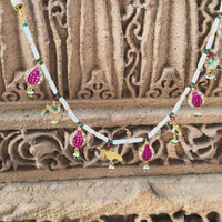 Jadau Kundan necklace with ruby pomegranate and emerald parrot motifs