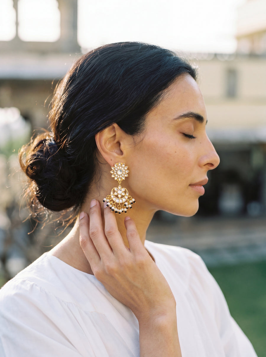 Jadau Kundan chandbali earrings with a sunburst stud and seed pearl fringe