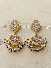 Jadau Kundan chandbali earrings with a sunburst stud and seed pearl fringe