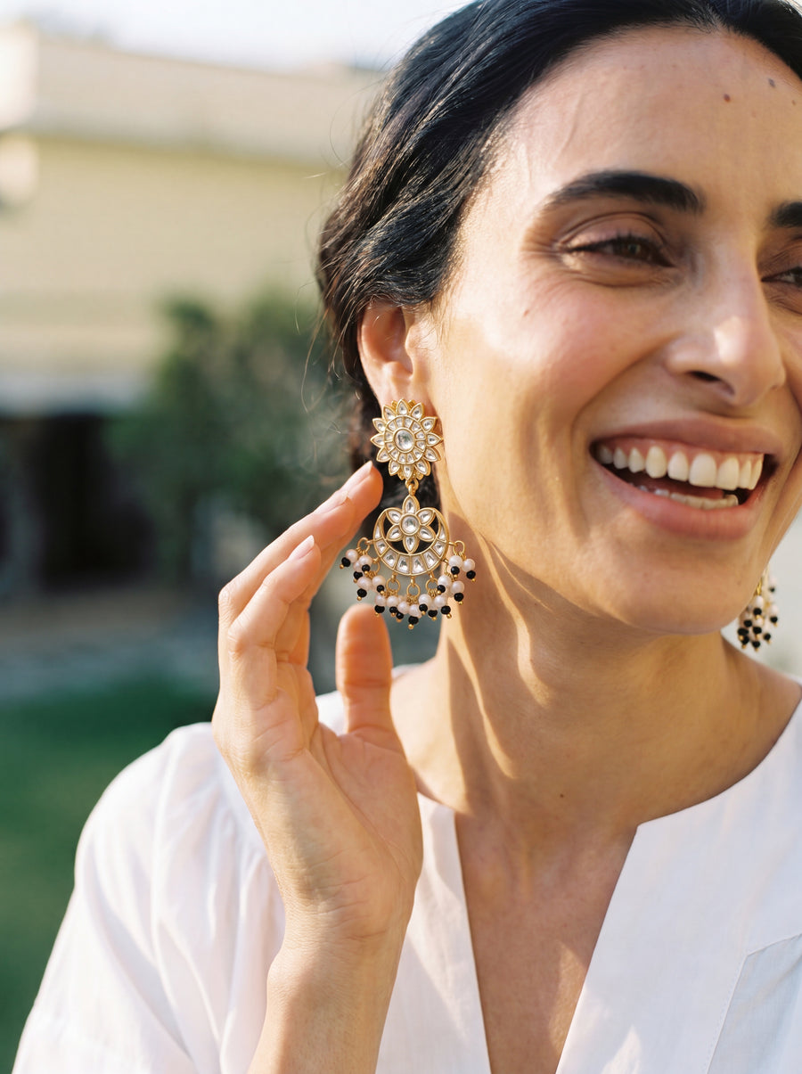Jadau Kundan chandbali earrings with a sunburst stud and seed pearl fringe
