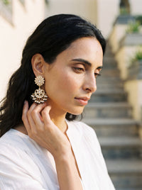 Jadau Kundan chandbali earrings with a sunburst stud and seed pearl fringe