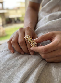 Kundan Polki ring with a three-star motif and seed pearl band
