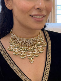 Kundan Polki choker with a dramatic jhumki and jade-pearl fringe