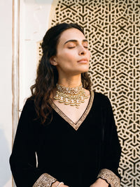 Kundan Polki choker with a dramatic jhumki and jade-pearl fringe