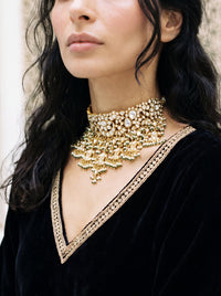 Kundan Polki choker with a dramatic jhumki and jade-pearl fringe