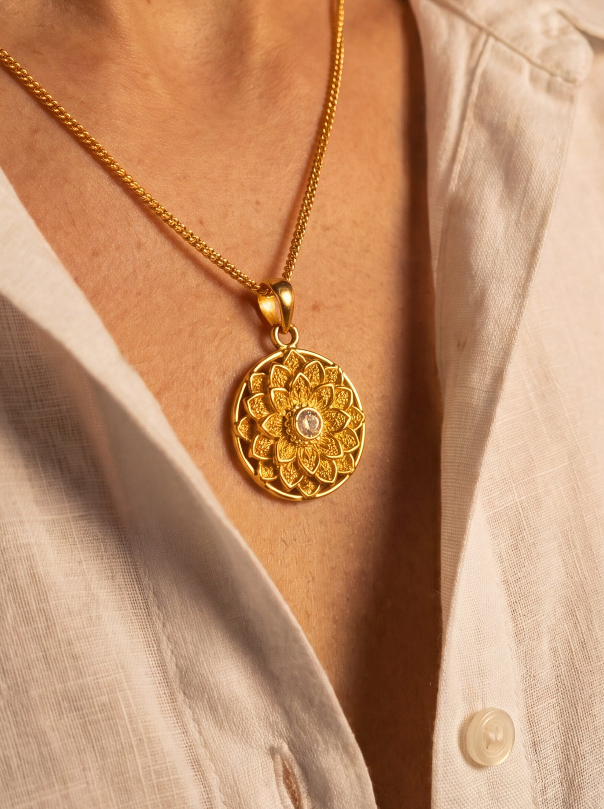 Engraved sunflower mandala pendant with a Kundan centre on a gold curb chain