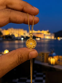 Engraved sunflower mandala pendant with a Kundan centre on a gold curb chain
