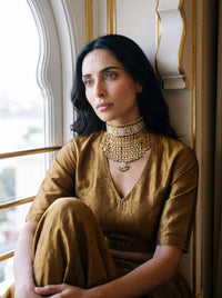 Jadau Kundan Aad choker with blue meenakari detailing and layered gold drops