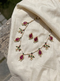 Jadau Kundan necklace with ruby pomegranate and emerald parrot motifs