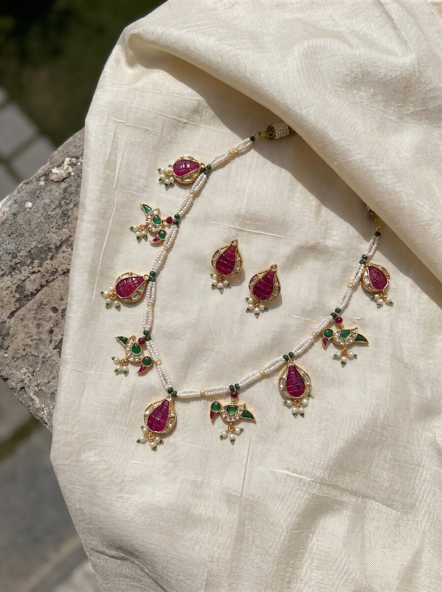 Jadau Kundan necklace with ruby pomegranate and emerald parrot motifs