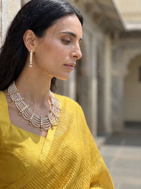 Jadau Kundan haar with six pearl strands and matching drop earrings